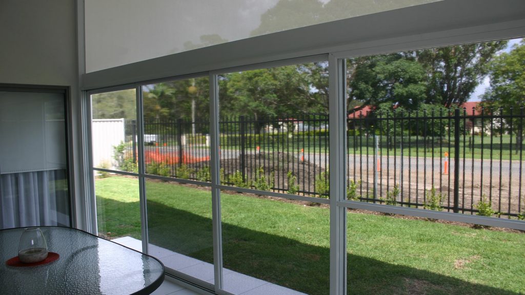 All Seasons Sliding Patio Panels with midge screen attached.