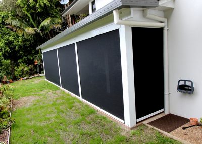 External view of the patio area showing the insulated patio roof extersion and the zip screen blinds