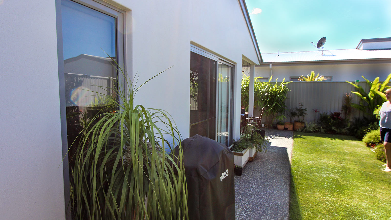 The small backyard was hot in the afternoon sun, and needed protection from rain.